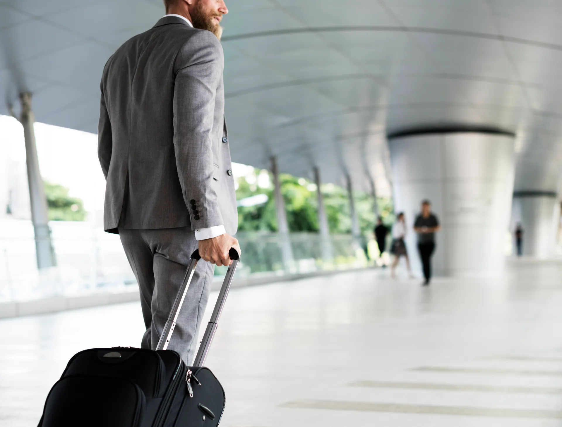 Professional chauffeur awaiting client at Dublin Airport arrivals - Hennessy Chauffeurs
